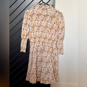 NWT!! To my lovers floral printed dress. Size S. Smocked sleeves and neck.